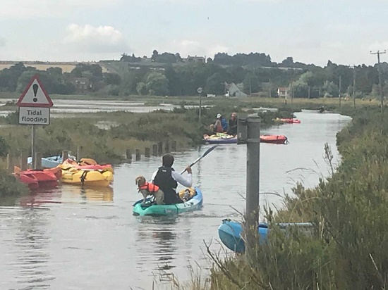 Kayaks at high tide